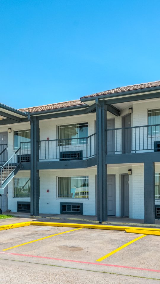 the motel is located in the parking lot of a hotel at The  Studios At Channelview